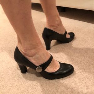 Black Mary Jane pumps.